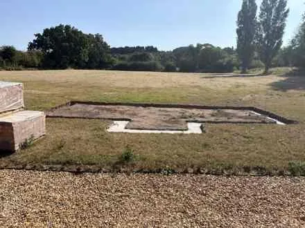 The greenhouse footings before construction, from the July 2026 project photograph